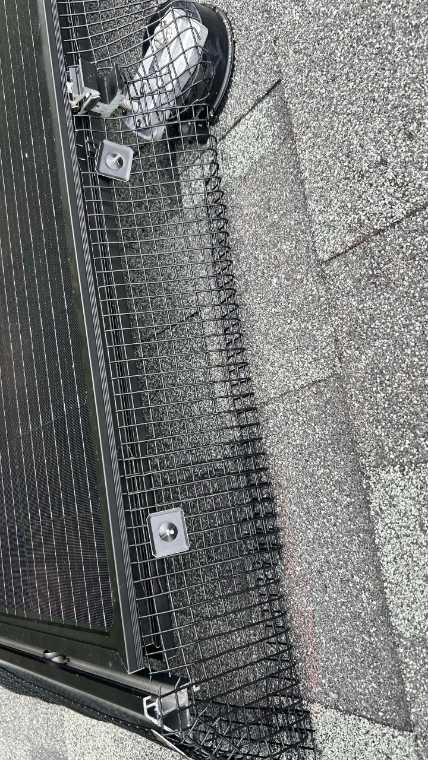 Critter guard installed on Tesla solar panel