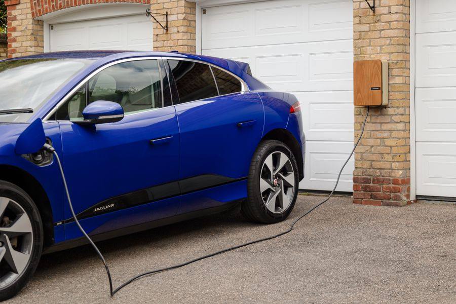 Electric car charging from a wall-mounted home EV charger