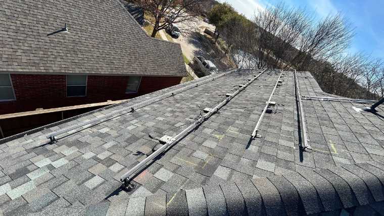 Solar racking on a shingle roof